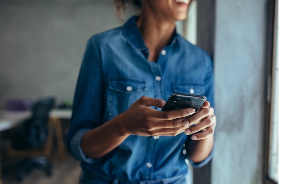 A woman using her phone.