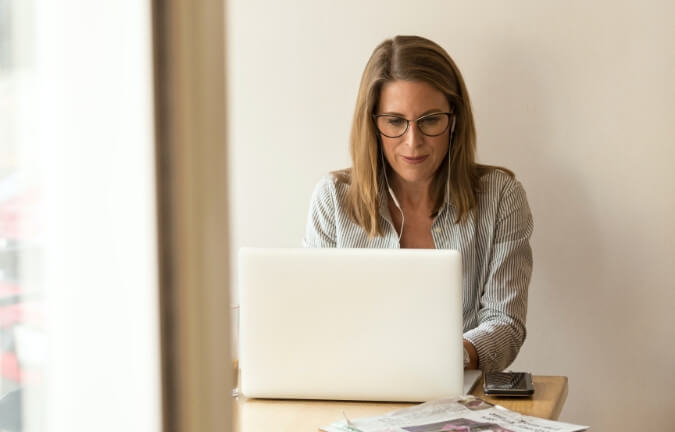 A woman working at her desk.