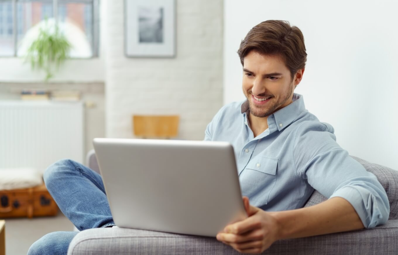 A man working on his laptop.